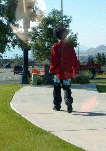 Darrien Hunt walks in Saratoga Springs with a sword minutes before he was shot and killed by Saratoga Springs police on Sept. 10, 2014. (Photo: Natalie Christensen)