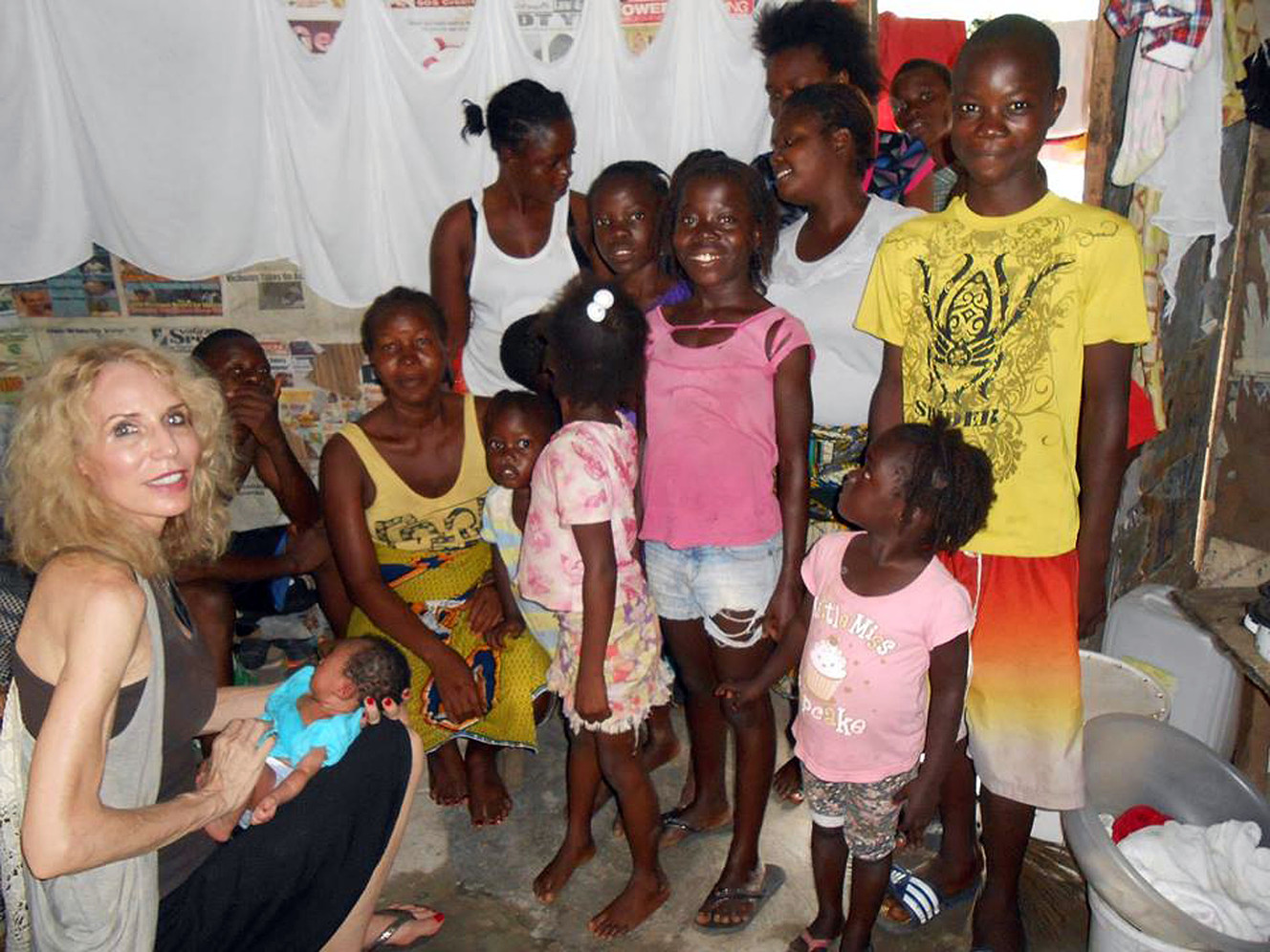 Karen Mathot, president of nonprofit, Lifting Liberia, is seen holding a baby that ultimately died of malaria in Monrovia, Liberia, in October 2014. (Photo: Provided by Karen Mathot)