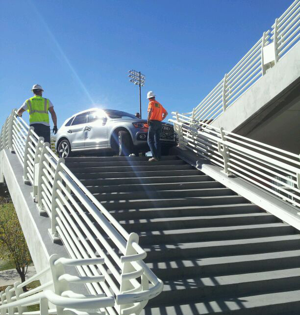 Man drives across bridge, gets stuck on campus stairs