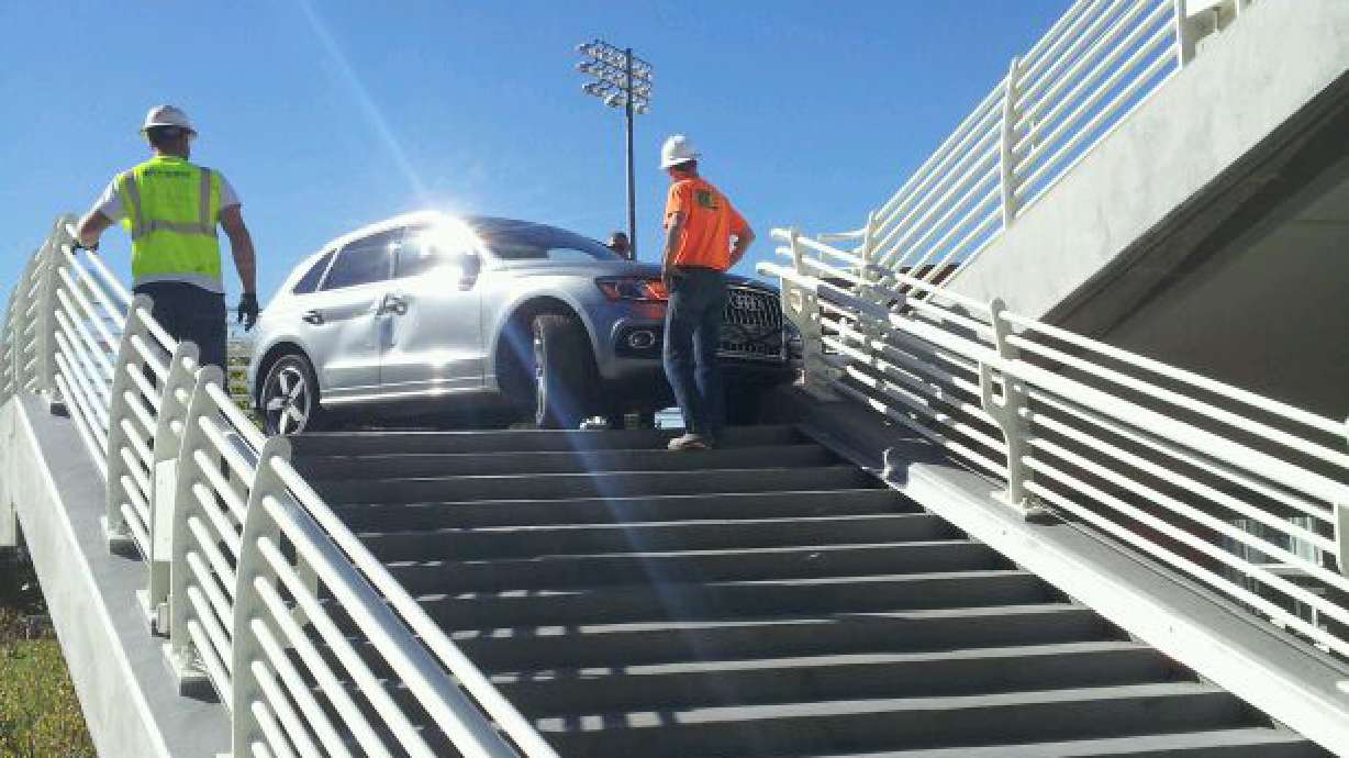 Man drives across bridge, gets stuck on campus stairs