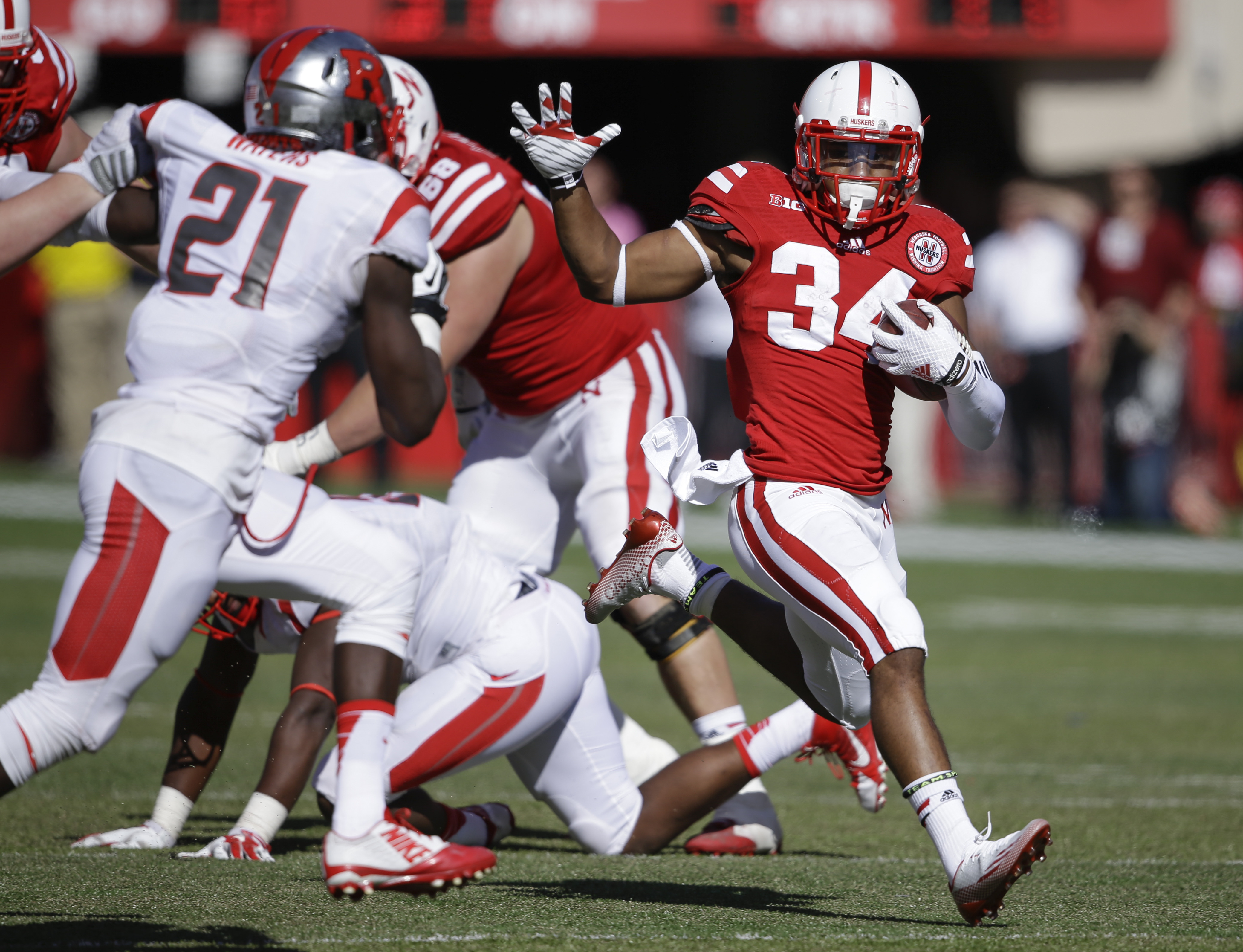 Nebraska running back Terrell Newby (34) runs away from Rutgers defensive back Lorenzo Waters (21) in the second half of an NCAA college football game in Lincoln, Neb., in this Oct. 25, 2014 file photo. (Associated Press)