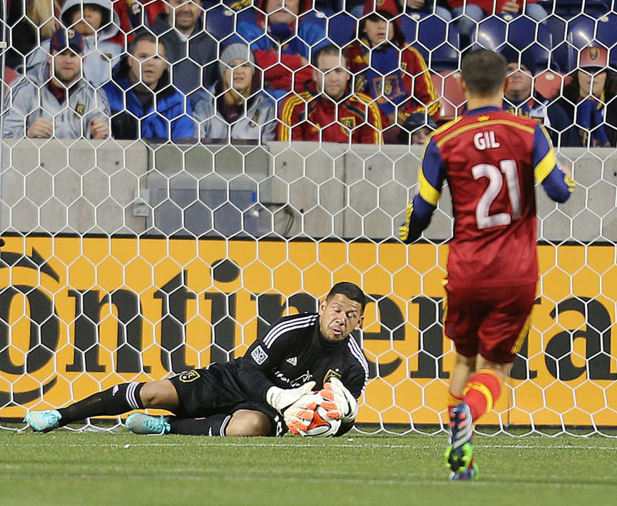 RSL goalkeeper Nick Rimando makes a save against the L.A. Galaxy during a 2014 MLS match while teammate Luis Gil looks on. Rimando was named to the seventh January camp in his career with the U.S. men's national team on Friday. (Scott G Winterton/Deseret News)