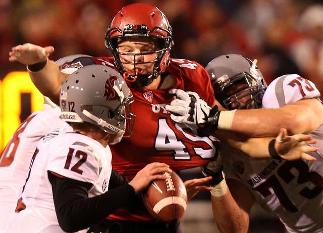 Utah's 49 Hunter Dimick rushes in to tackle Washington State QB Connor Halliday (Photo: Laura Seitz, Deseret News)