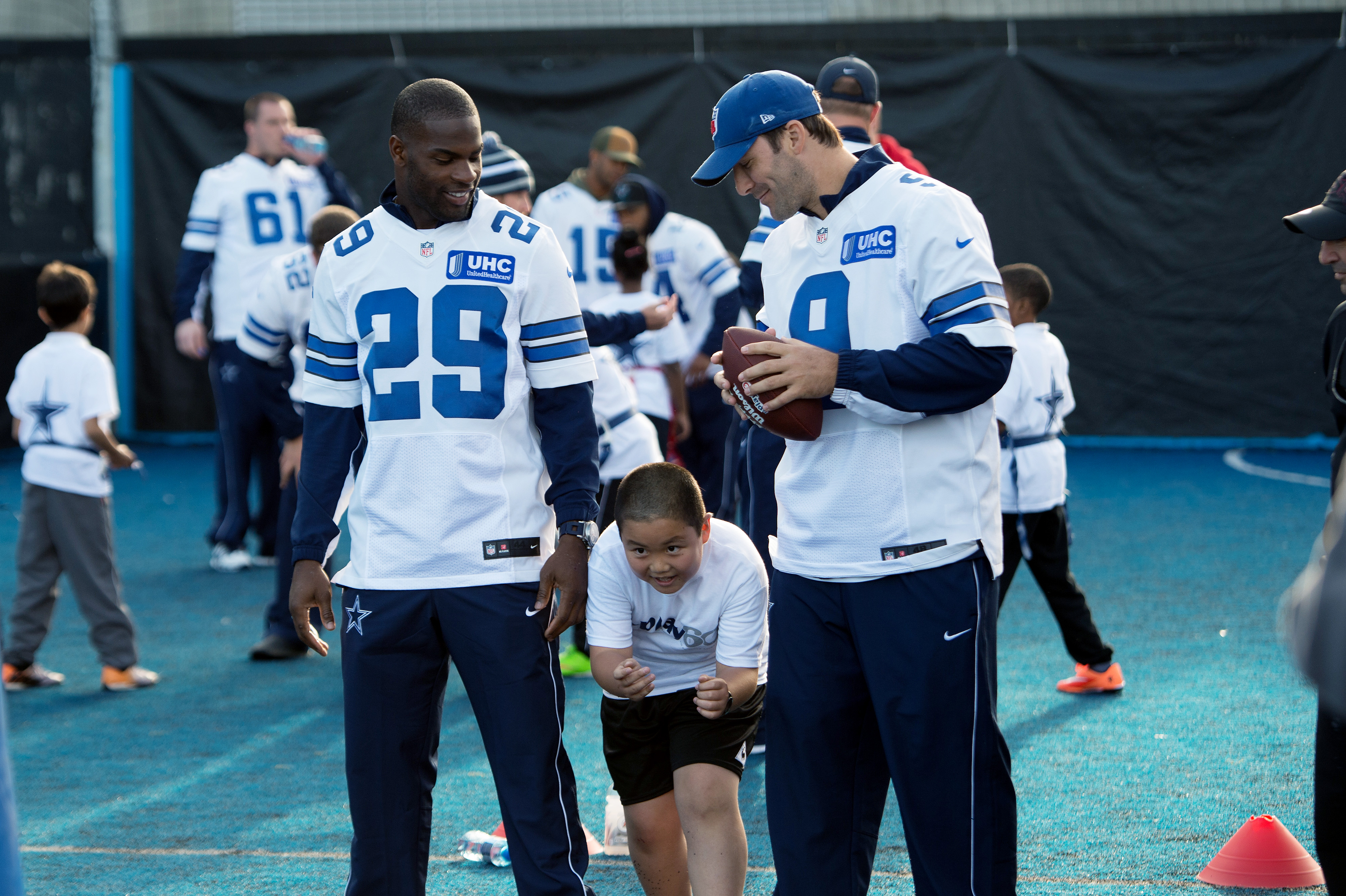 Romo skips practice in London with injured back