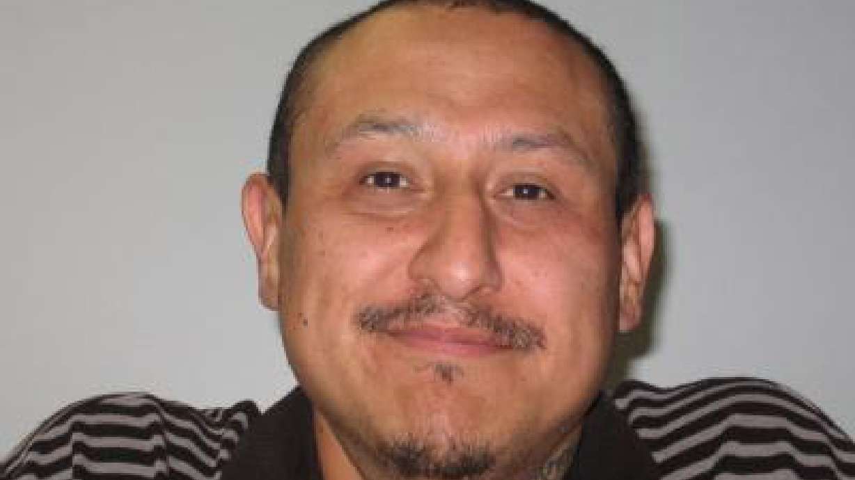 Probation fugitive shoots at officers prior to arrest, officials say