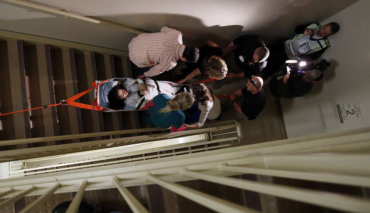Kenya Alia Al-hisnawi, who acts as though she has leg injuries, is transported in a Paraslyde during an earthquake drill at Lone Peak Hospital in Draper, Wednesday, Nov. 5, 2014. (Photo: Ravell Call, Deseret News).