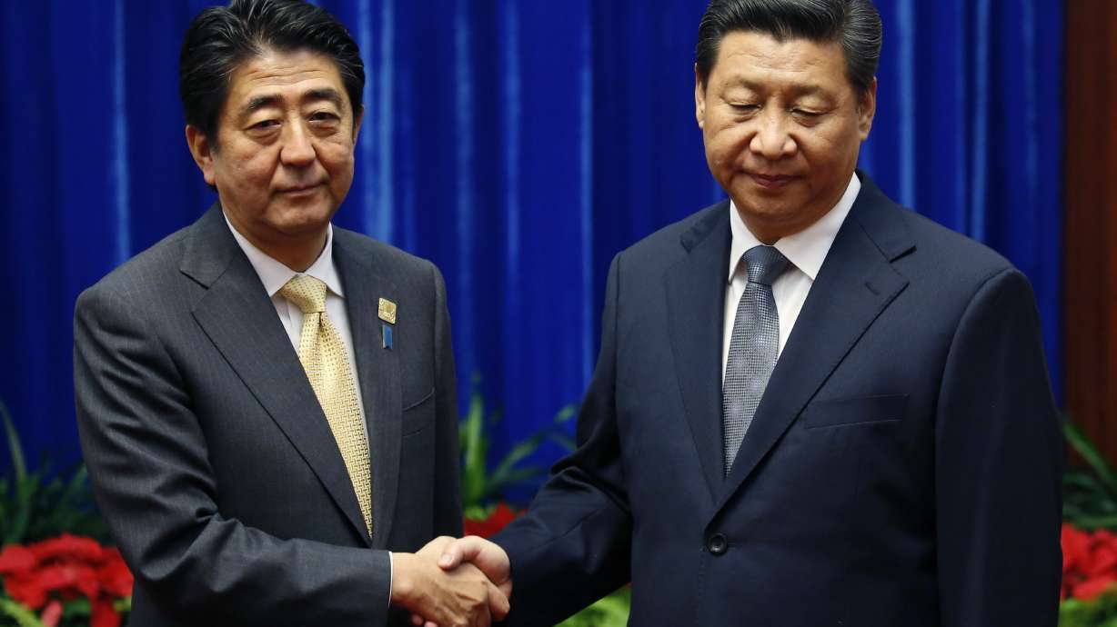 An awkward handshake: Leaders of China, Japan meet