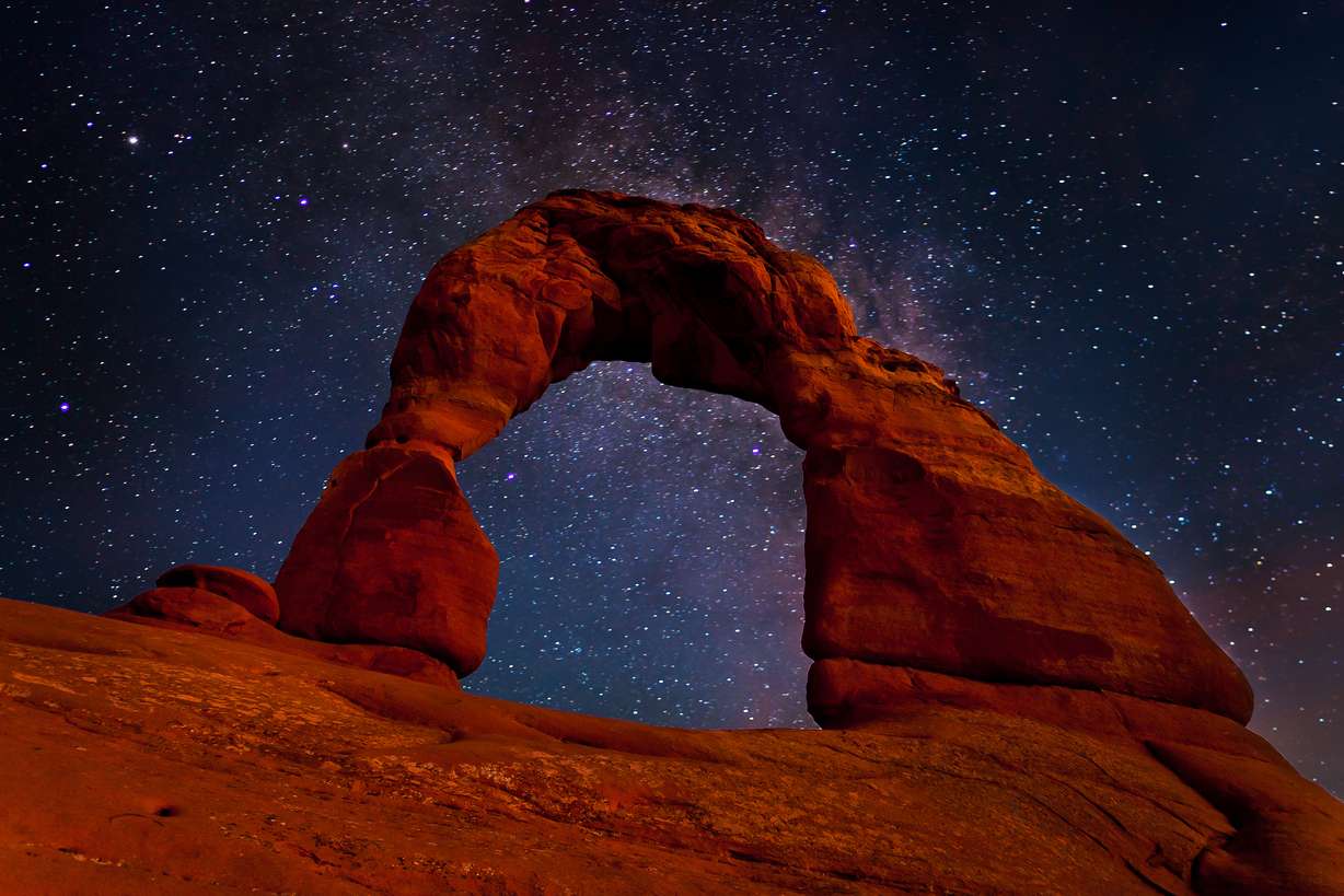 A shot from underneath Delicate Arch in the evening. (Photo: Paul Langereis/Shutterstock.com)