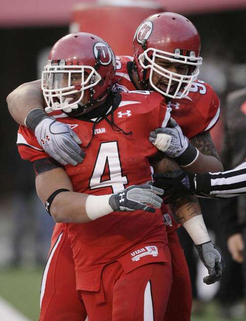 Utah Utes running back Matt Asiata (4) scores against BYU in college football action in Salt Lake City, Utah, Saturday, Nov. 27, 2010. (Jeffrey D. Allred, Deseret News)