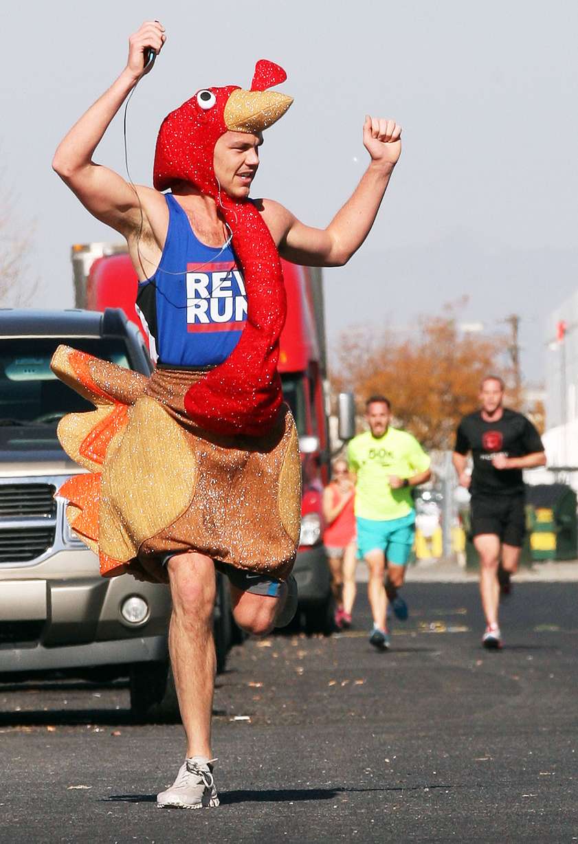 Nick Peterson, aka The Gobbler, runs in the USANA Turkey Trot 5K in Salt Lake City, Thursday, Nov. 6, 2014. He placed second. USANA employees donated more than 800 pounds of food to the Utah Food Bank. (Photo: Ravell Call/Deseret News)