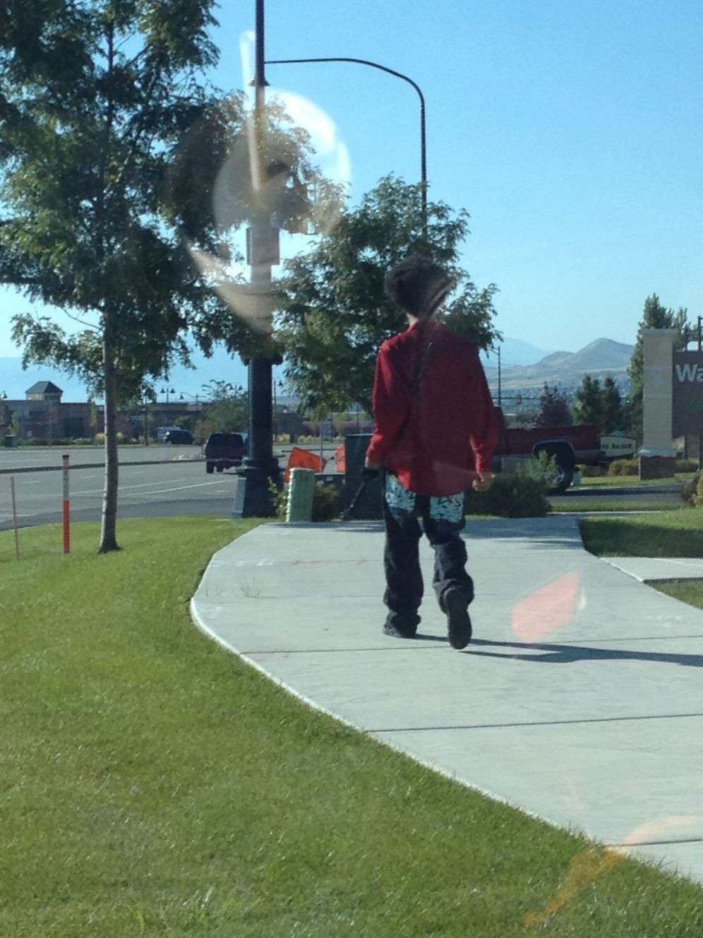 This photograph was taken minutes before Darrien Nathaniel Hunt, 22, of Saratoga Springs, was shot and killed by police Wednesday, Sept. 10, 2014, as he was walking near a Panda Express restaurant while carrying a Samurai sword. A woman driving in the area took the photo to send to her husband because she thought it was odd. But she said he didn't seem threatening. Investigators on Saturday said he brandished the sword and lunged toward officers, prompting them to shoot him. (Photo: Natalie Christensen)