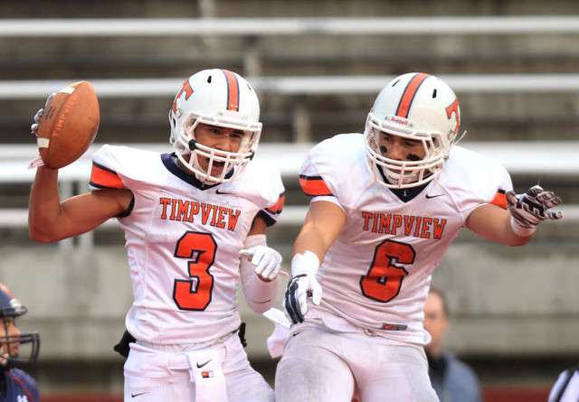 Timpview's Jordy Espinoza, left and Tristan Bradley celebrate after Espinoza's touchdown 4A semifinal high school football game against Woods Cross in the Rice-Eccles Stadium Friday, Nov. 14, 2014, Salt Lake City. (Photo: Hugh Carey)