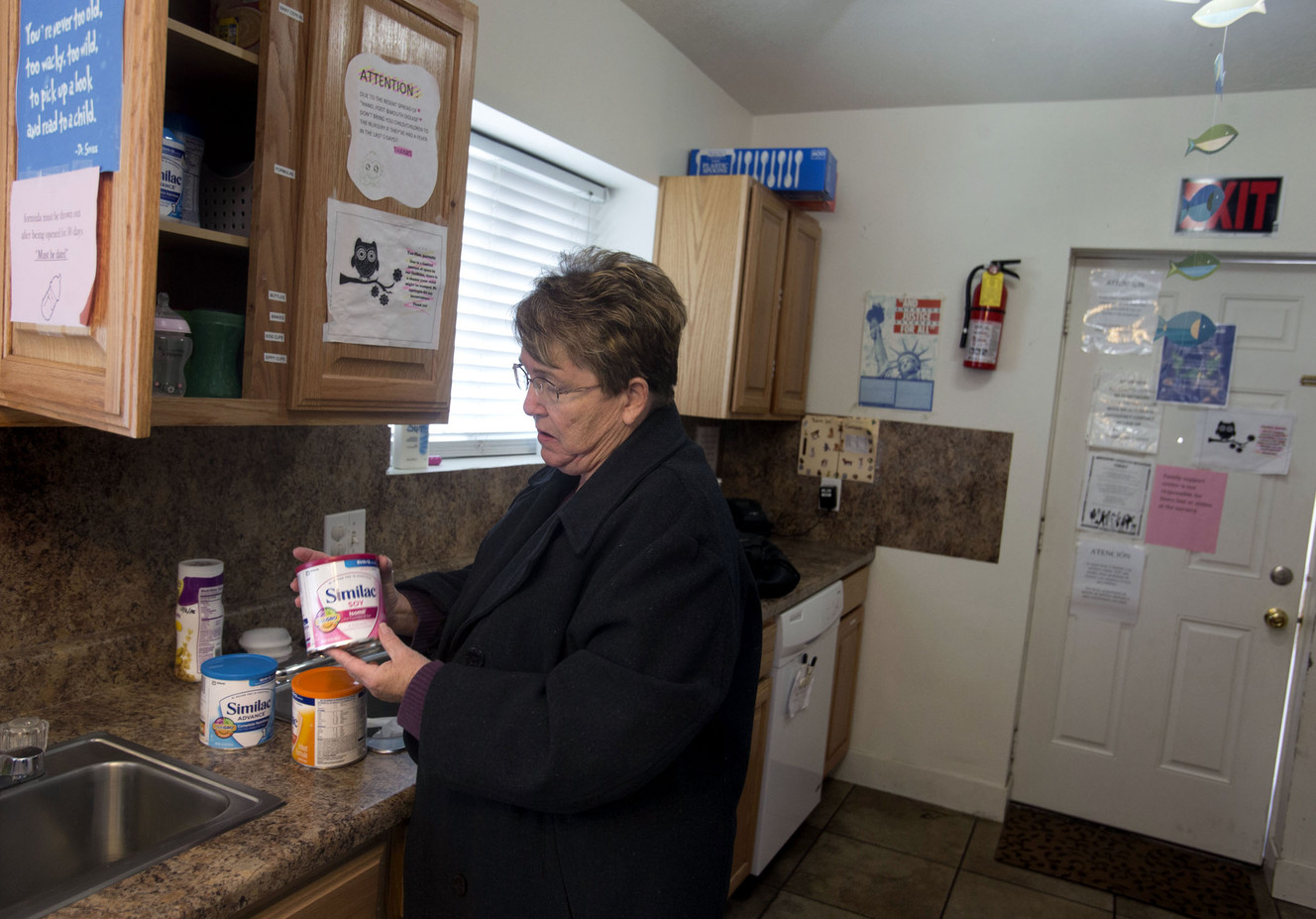 Bonnie Peters, executive director of the Family Support Center, stocks the cupboard with infant formula after running to a local market to purchase formula with her own money at the center in West Valley City on Wednesday, Nov. 12, 2014. The Family Support Center, a private nonprofit organization whose mission is to protect children, strengthen families and prevent child abuse is at an all-time low in having formula to feed the infants who use crisis nurseries in the Salt Lake Valley. (Photo: Laura Seitz, Deseret News)