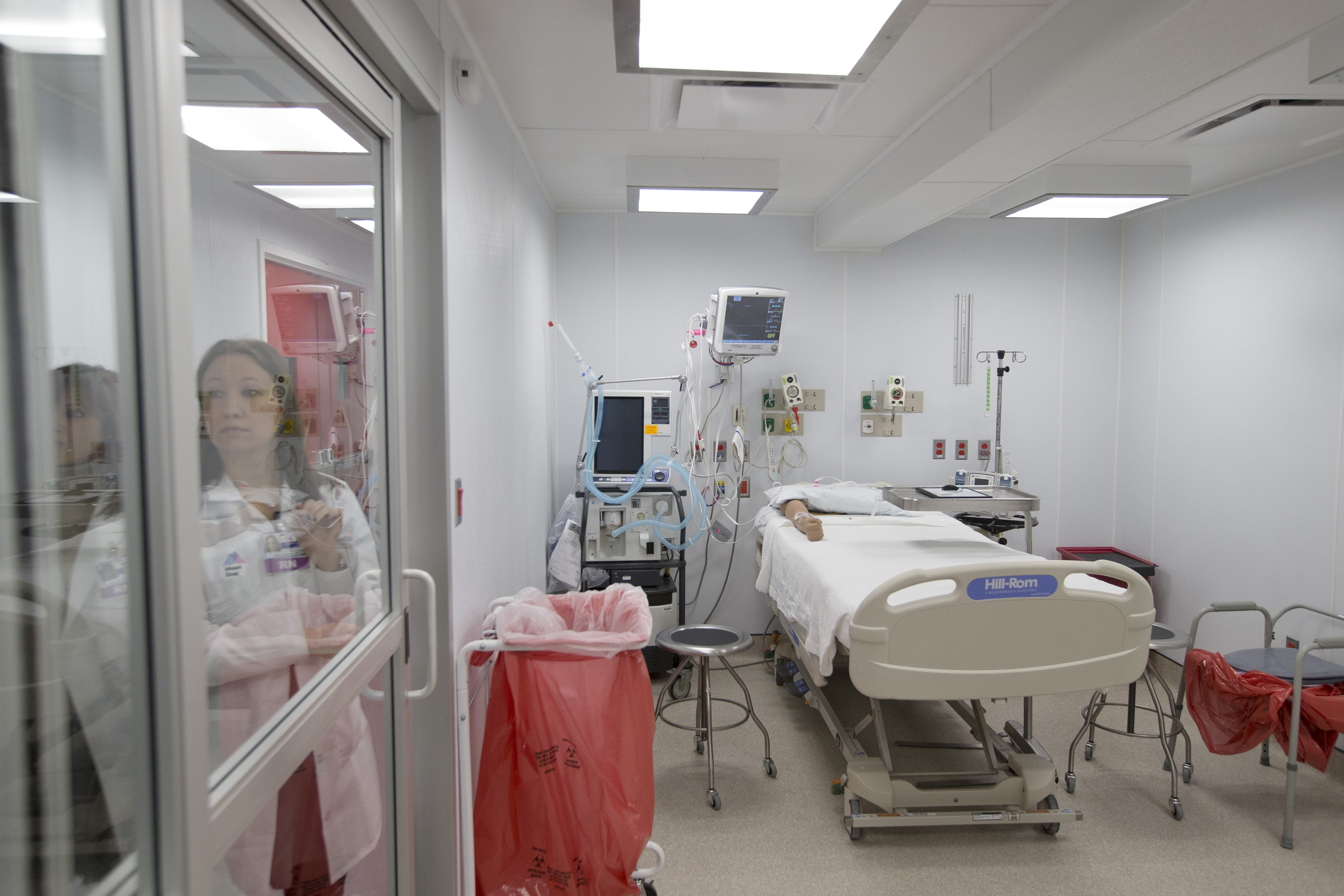 Hospitals improvise Ebola defenses, at a cost