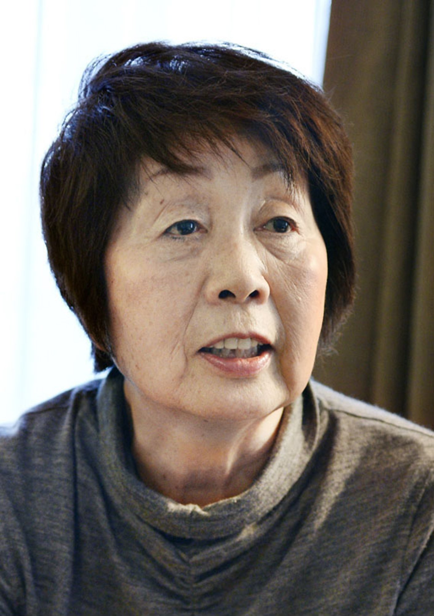 Japan police comb suspected spouses killer's home