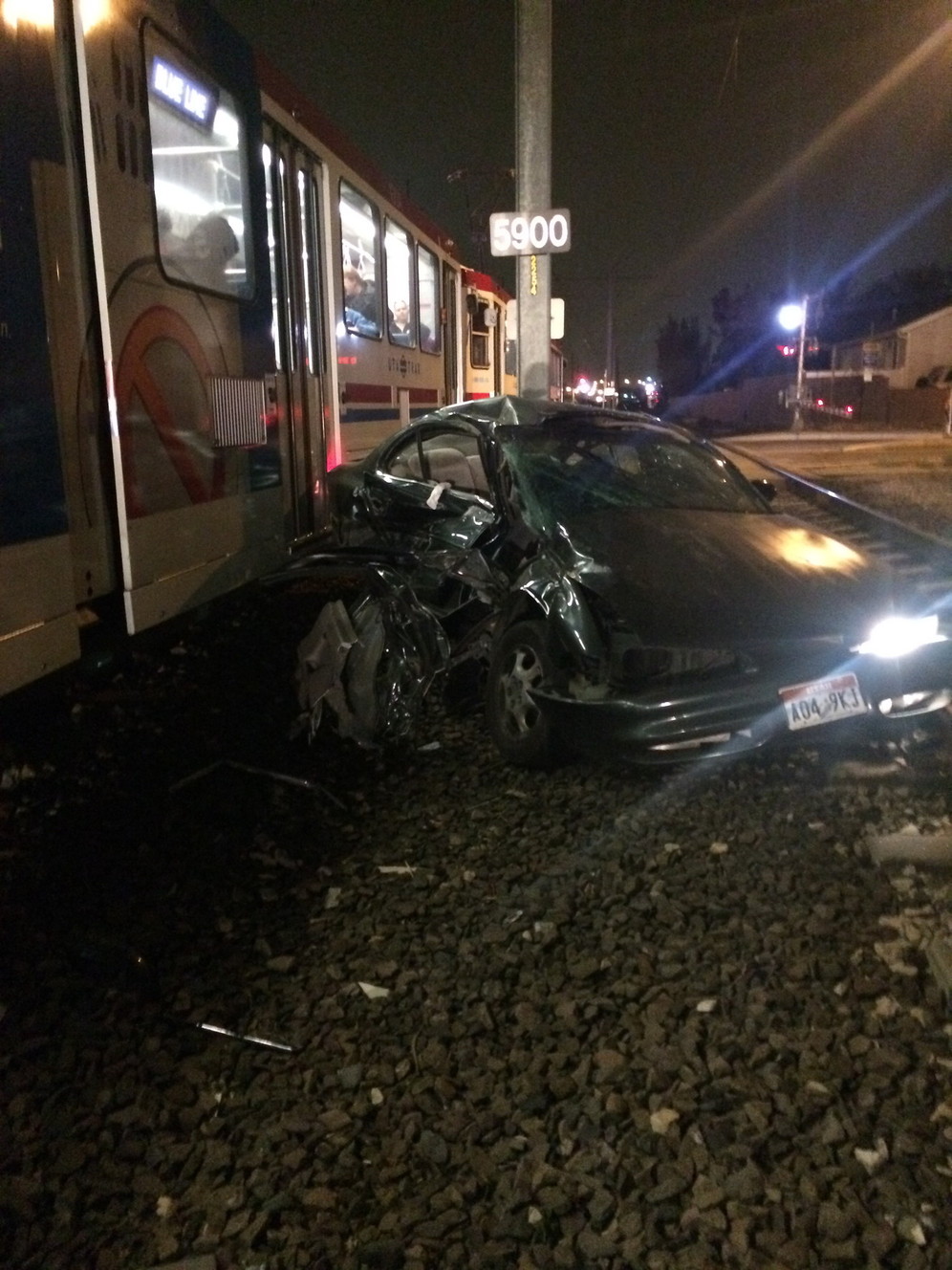 Janice Parkinson's car sits at the railroad crossing at 5900 South and 300 West in Murray after being hit by a TRAX train Thursday, Nov. 12, 2014. (Photo: Suzanne Slifka)