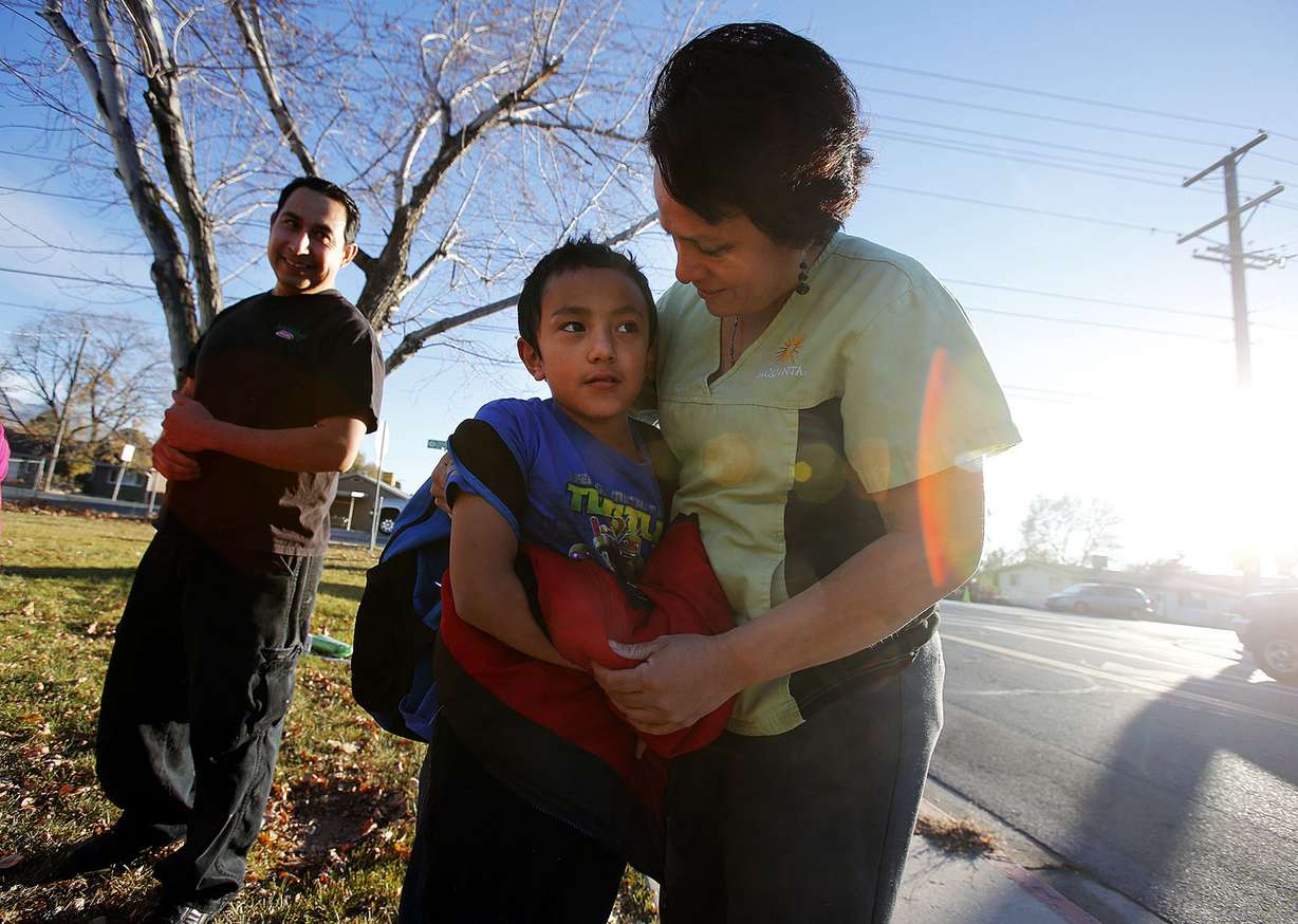 Andres Torres and Rosa Better greet their son Gustavo Andres Torres as he arrives home from school in Orem, Thursday, Nov. 20, 2014. (Photo: Ravell Call, Deseret News)