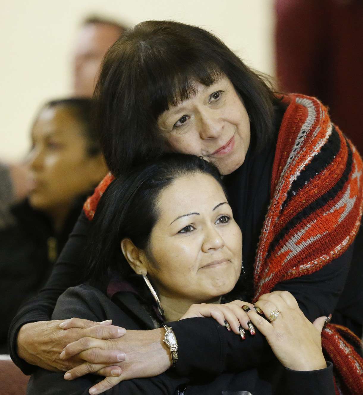 Alicia Cervantes and Brandy Farmer hug as Utah Latinos watch the live announcement of President Obama̢۪s executive order at Centro Civico Mexicano in Salt Lake City on Thursday, Nov. 20, 2014. (Photo: Jeffrey D. Allred, Deseret News)