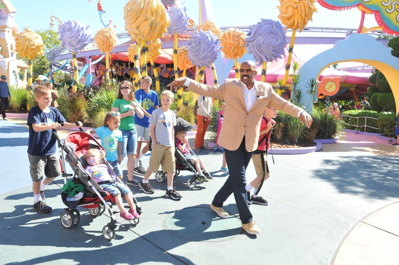 The Aaron Ball family joins Steve Harvey on the set at Universal Orlando Resort. (Photo: Genie LaVine, NBC)
