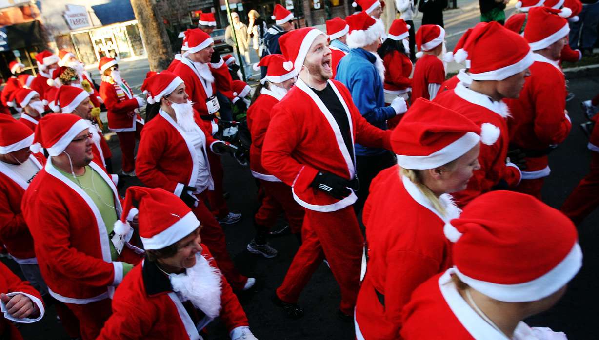 A group of about 350 running Santas leave from the starting ling during the 5k Santa Run in Provo Friday, November 26, 2010. (Brian Nicholson, Deseret News)