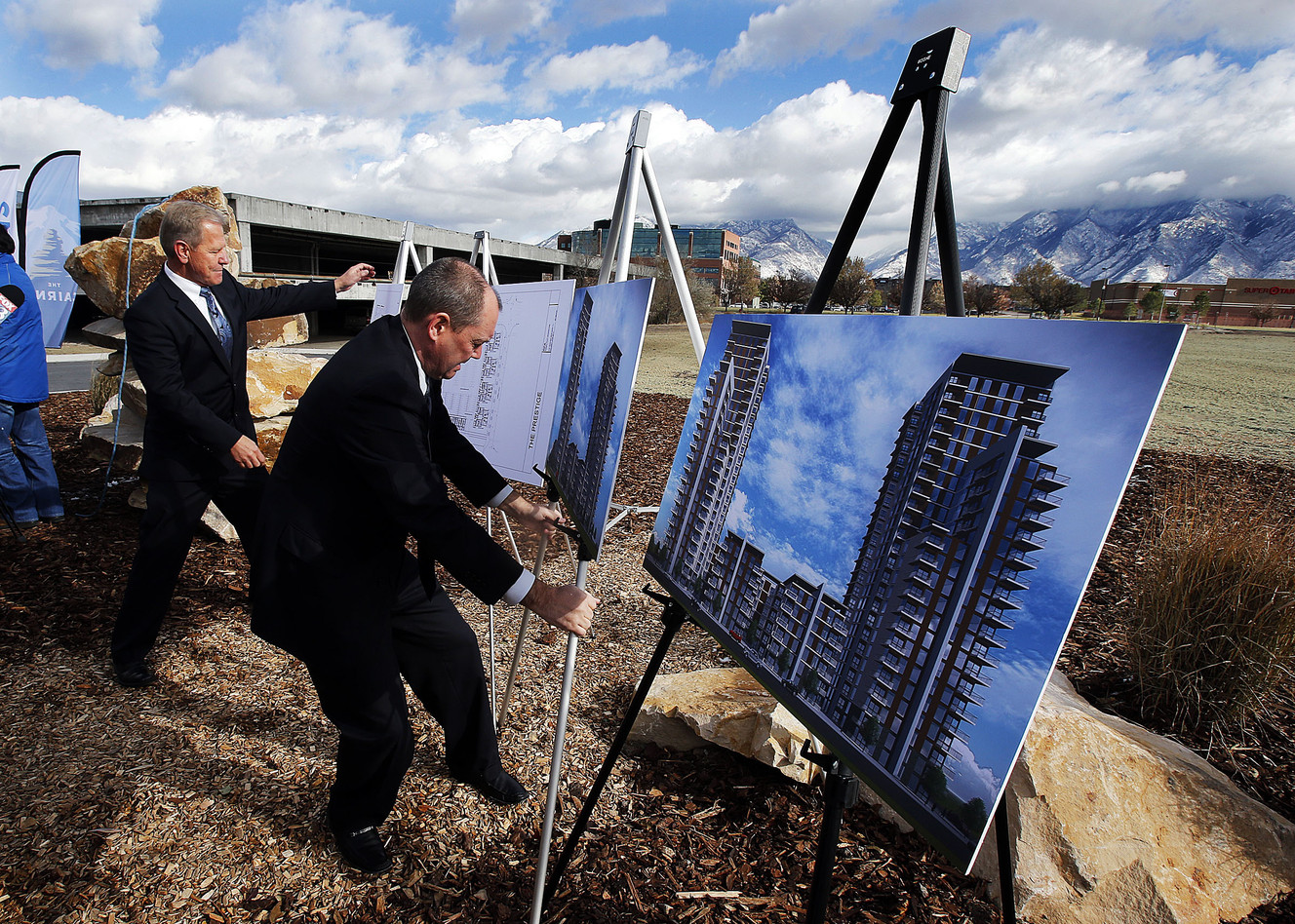 Russell Platt, front, and Dan Simons, of Simons Platt Creations, display renderings for The Prestige, a high-rise residential building in Sandy, Monday, Nov. 24, 2014. This building will be part of The Cairns, a 1,100-acre city center development in Sandy. (Photo: Ravell Call, Deseret News)