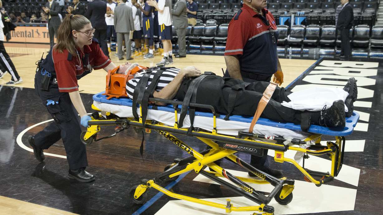 Referee injured and stretchered off court