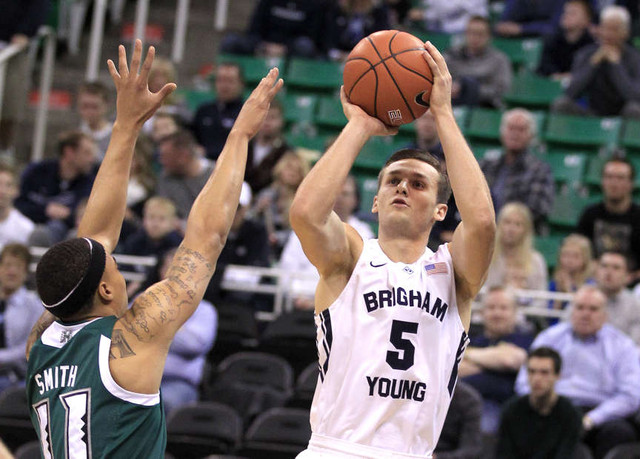 Brigham Young Cougars guard Kyle Collinsworth shoots for three while being guarded by Hawaii Warriors guard Quincy Smith during the game in the Energy Solutions Arena Saturday, Dec. 6, 2014, in Salt Lake City. (Hugh Carey/Deseret News)