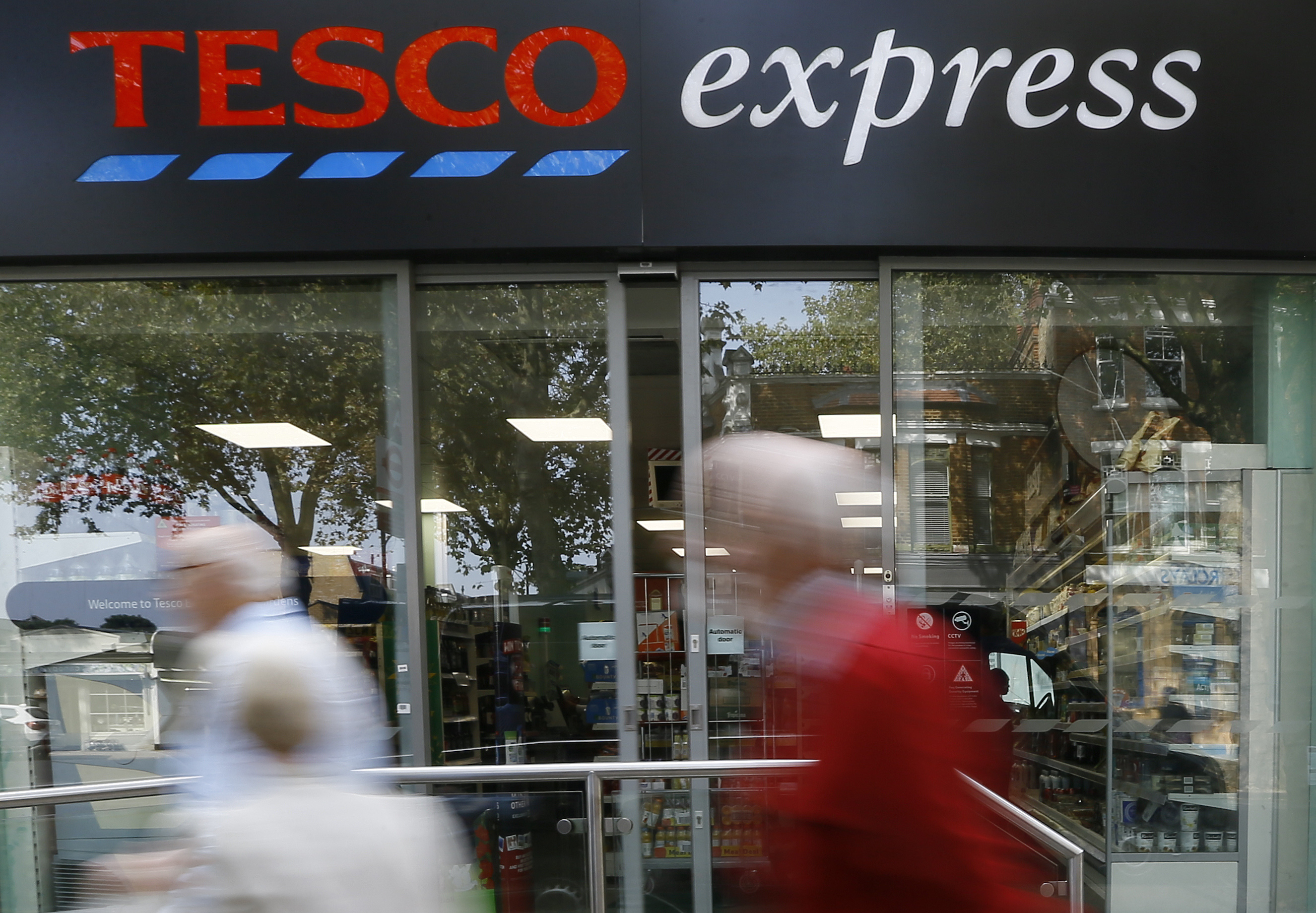 Tesco shares dive after full-year profit warning
