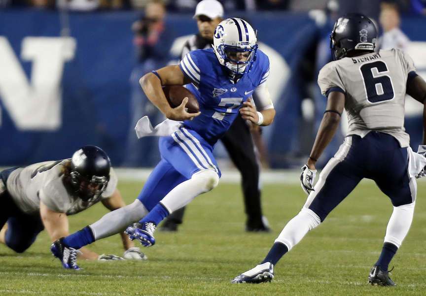 Christian Stewart (7) of the Brigham Young University Cougars runs against USU during NCAA football in Provo, Friday, Oct. 3, 2014. (Ravell Call, Deseret News)