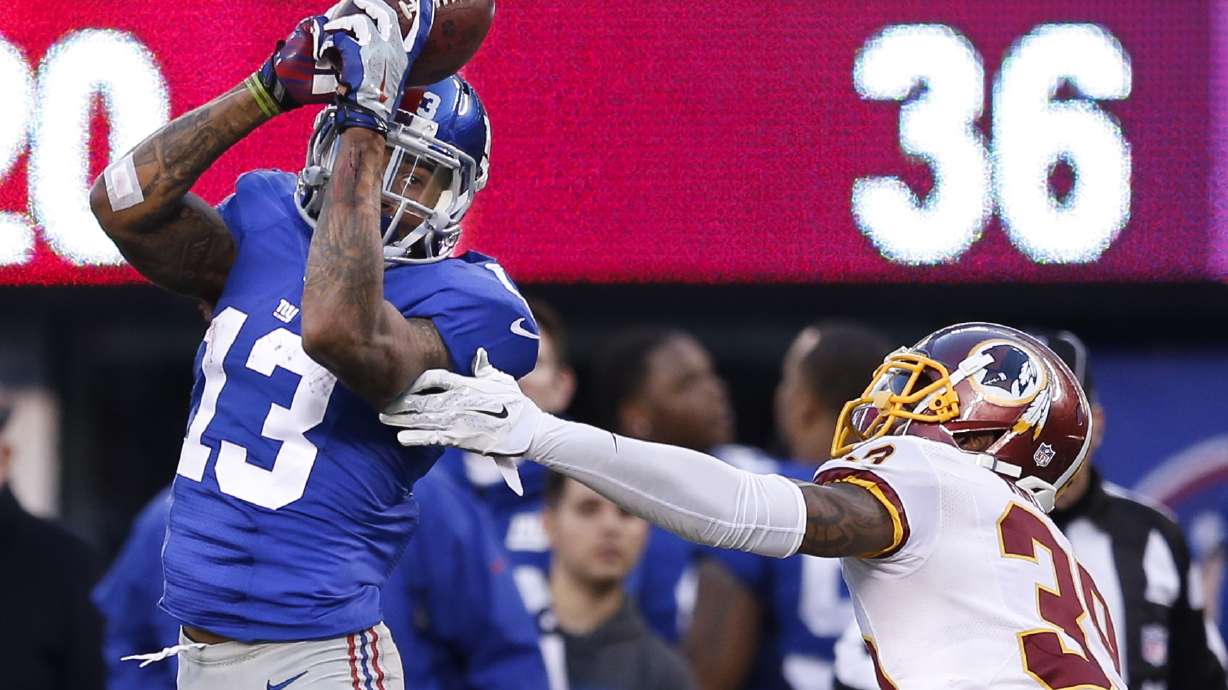 Manning hits Beckham on 3 TD passes in Giants win