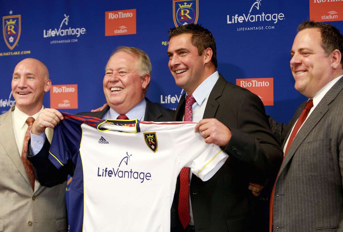 Garth Lagerwey, Bill Manning, Jeff Cassar and RSL owner Dell Loy Hansen hold up a jersey during the unveiling of Cassar as the franchise's new head coach at a press conference in 2013. (Kristin Murphy/Deseret News)