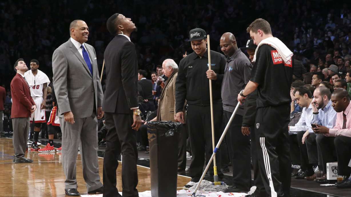 Wade leads Heat past Nets 95-91