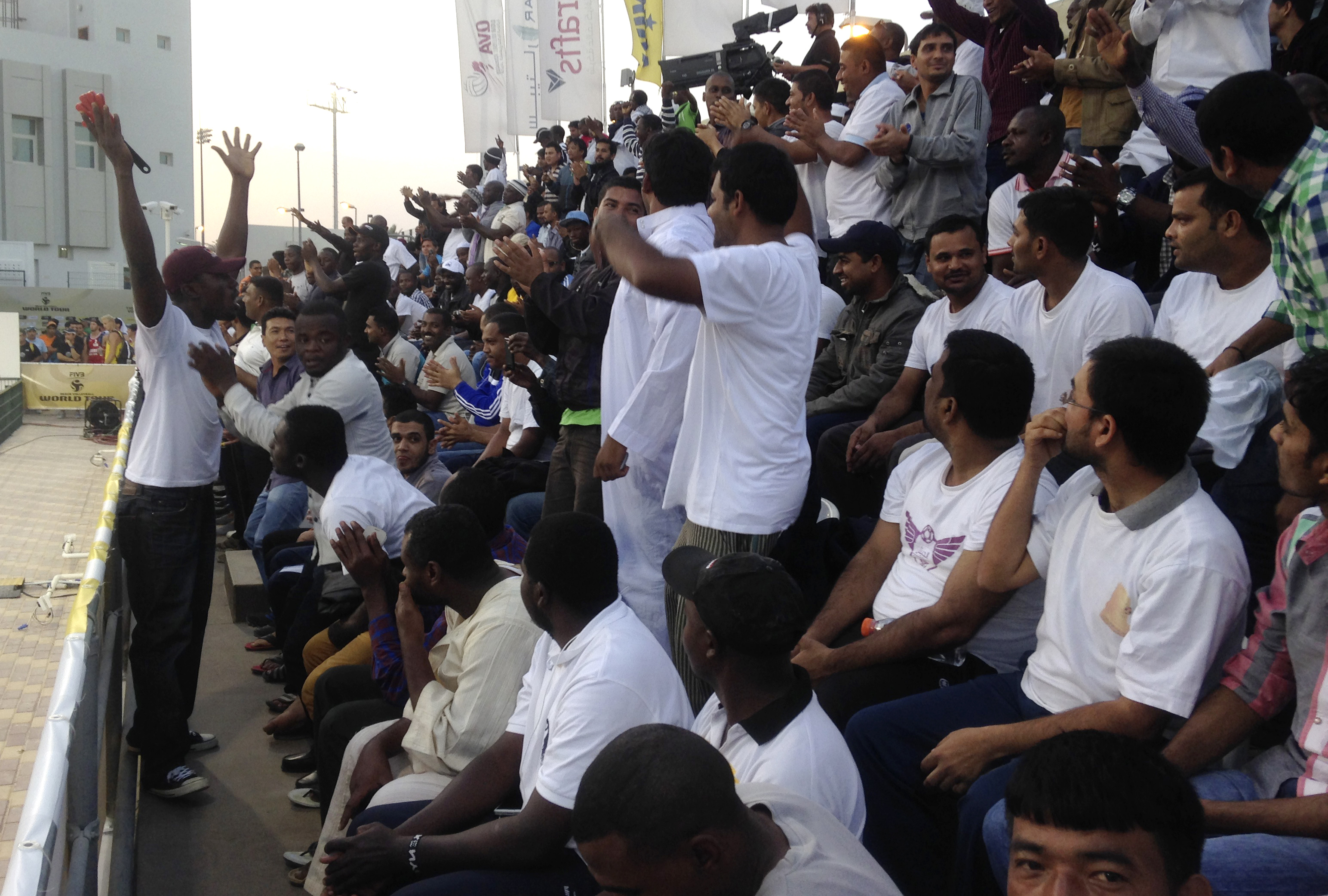 In Qatar, migrant workers paid to be sports 'fans'