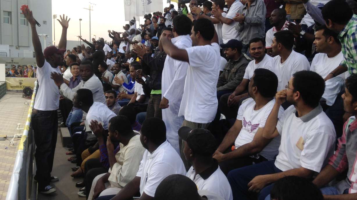 In Qatar, migrant workers paid to be sports 'fans'