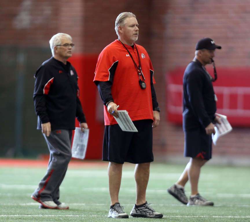 Running back coach Dennis Erickson, left, offensive coordinator Dave Christensen and Head Coach Kyle Whittingham watch football practice at the University of Utah (Laura Seitz, Deseret News)