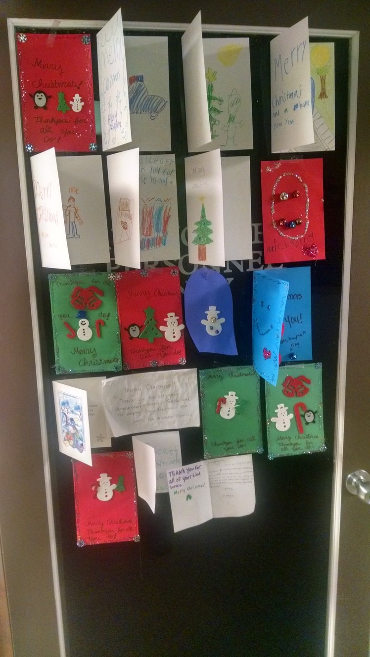 "We're so grateful to see that the citizens recognize that a lot of the officers are dads and husbands," Sgt. Christensen said. Sheriff's deputies display handmade cards in their office from Eagle Mountain children. (Photo: Cole Christensen)