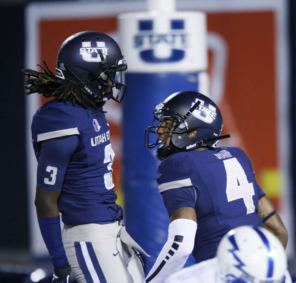 Utah State Aggies wide receiver Hunter Sharp (4) celebrates his touchdown against Air Force Falcons with Utah State Aggies wide receiver Devonte Robinson (3) in Logan Saturday, Oct. 11, 2014. (Jeffrey D. Allred/Deseret News)
