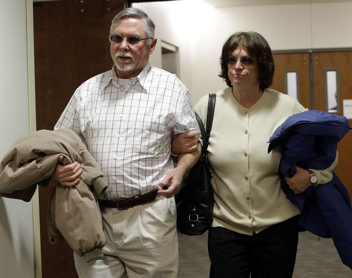 FILE - In this March 12, 2013, file photo, Robert and Arlene Holmes, the parents of Aurora theater shooting suspect James Holmes, arrive at district court for the arraignment of their son in Centennial, Colo. (AP Photo/Ed Andrieski, File)