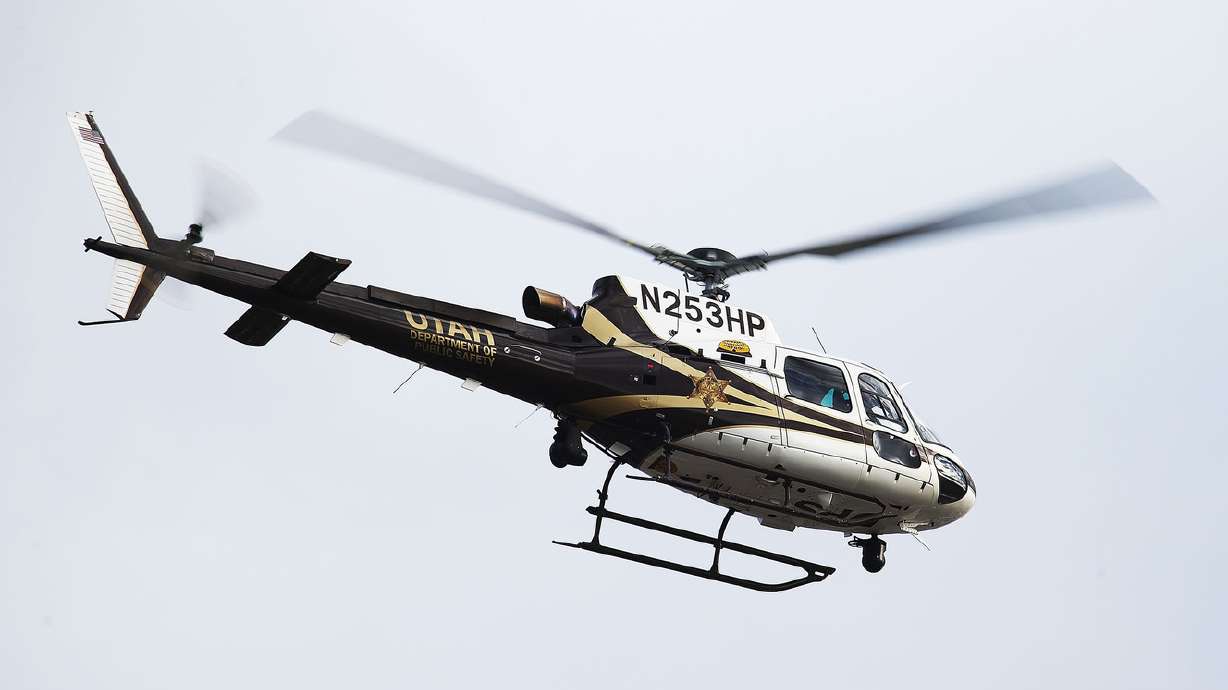 Police arrested a man suspected of driving a stolen vehicle overnight in Taylorsville after they say he fled from officers and then crashed into a parked car, prompting a search with drones and the Department of Public Safety helicopter.