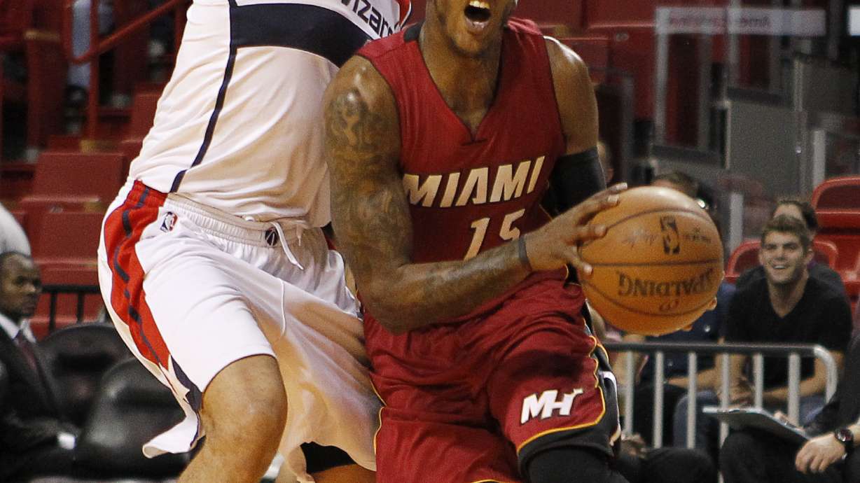 Wizards rally down stretch, top Heat 105-103