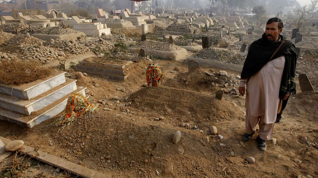 Burying the dead after Pakistan's school massacre