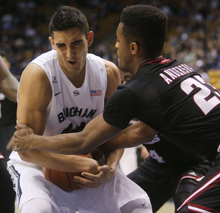 Brigham Young center Corbin Kaufusi (44) wrestles with Massachusetts guard C.J. Anderson (23) for the ball as BYU and UMass play Tuesday, Dec. 23, 2014, at the Marriott Center in Provo. (Scott G Winterton/Deseret News)