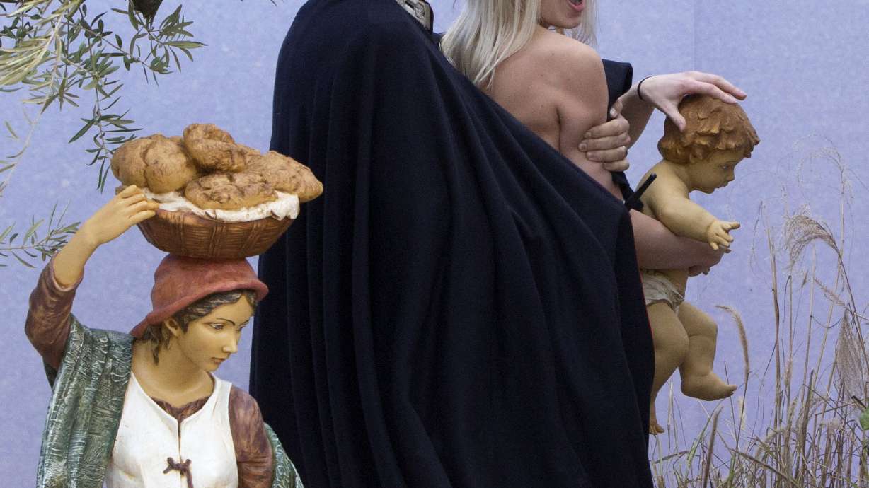 Vatican arrests activist who bared chest in square