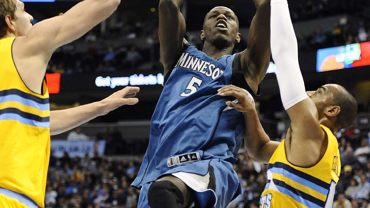 Faried grabs 25 rebounds as Denver beats Minnesota 106-102