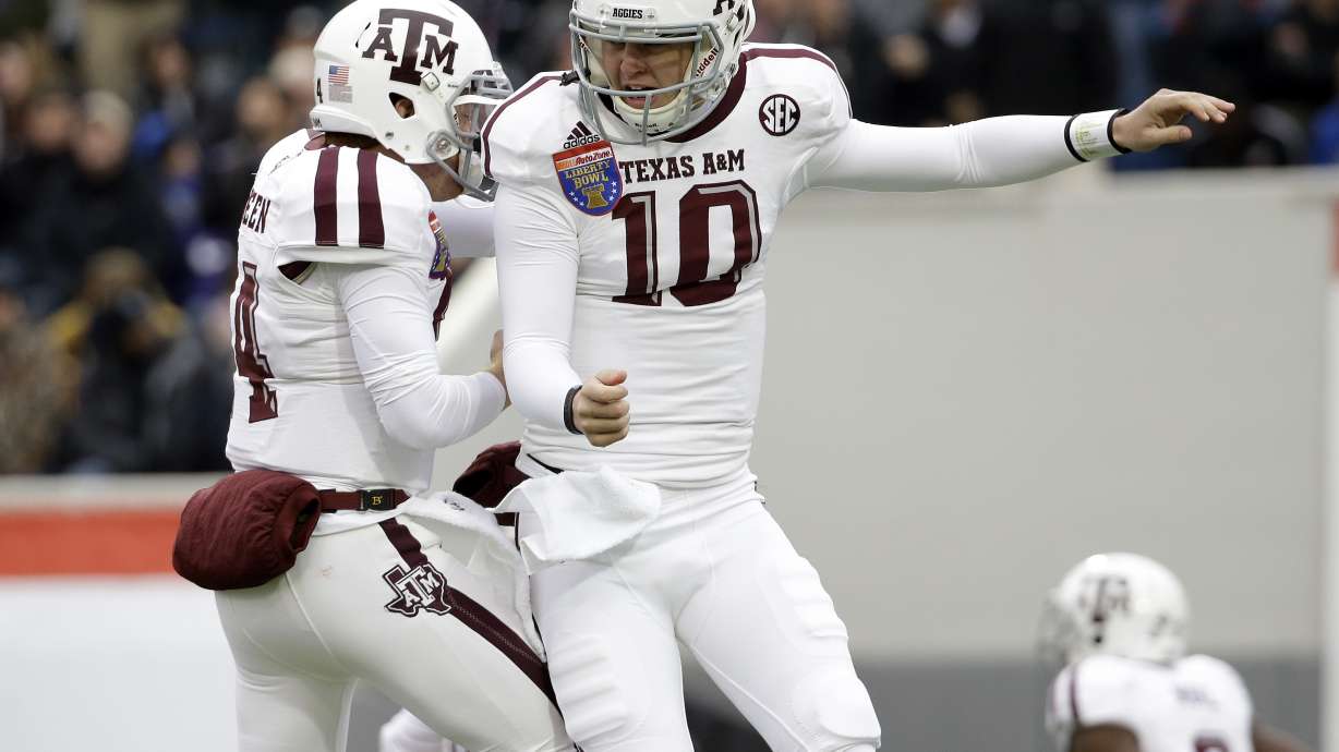 Allen leads Aggies past WVU 45-37 in Liberty Bowl