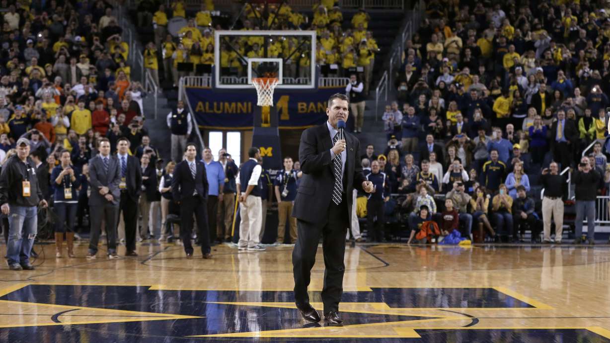 Harbaugh watches Michigan top Illinois 73-65 in OT