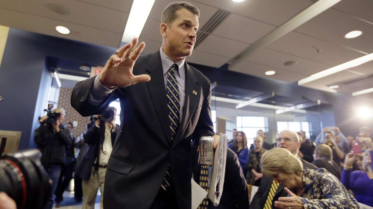 Rousing reception for Harbaugh in Michigan return