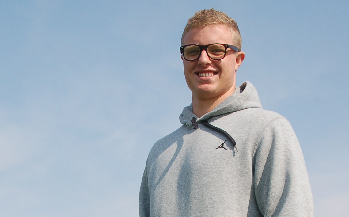 Ex-college football player charged with stalking mogul