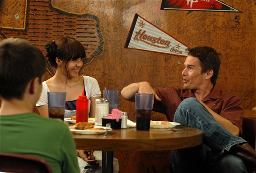 In this image released by IFC Films, from left, Ellar Coltrane, Lorelei Linklater and Ethan Hawke appear in a scene from "Boyhood." (AP Photo/IFC Films)