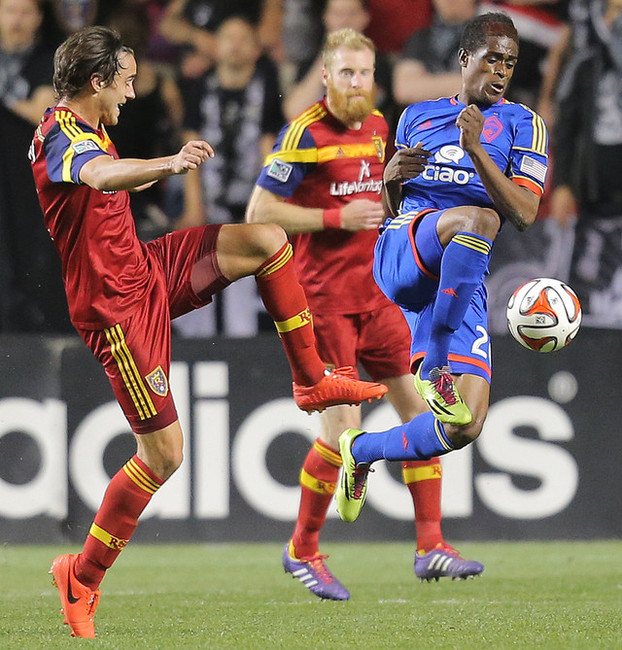 RSL's Cole Grossman tries to kick the ball away from Colorado\'s Deshorn Brown as Real Salt Lake and the Colorado Rapids play Saturday, May 17, 2014 at Rio Tinto Stadium in Sandy. Grossman recently signed with Norwegian side Stabaek and former USMNT coach Bob Bradley. (Scott G Winterton/Deseret News)